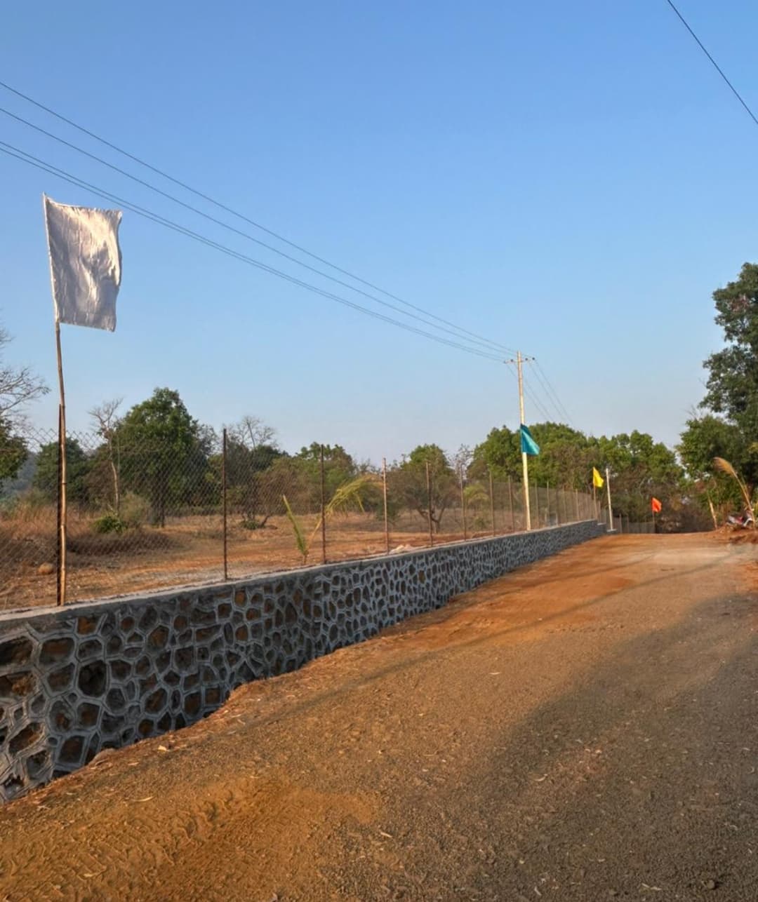 Raw land preparation for future farmhouse plots in Sahyadri region