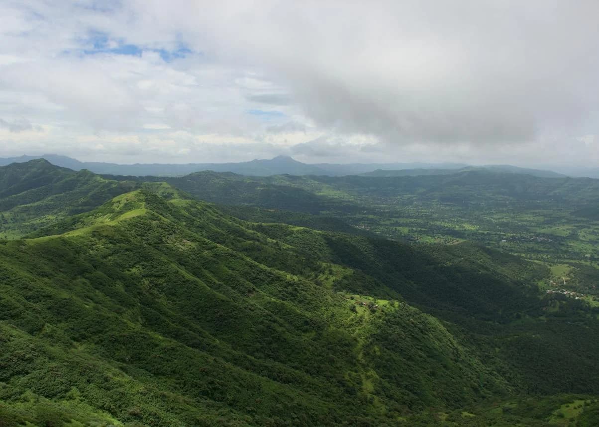 Panoramic view of Velhe region countryside with rolling hills near Pune