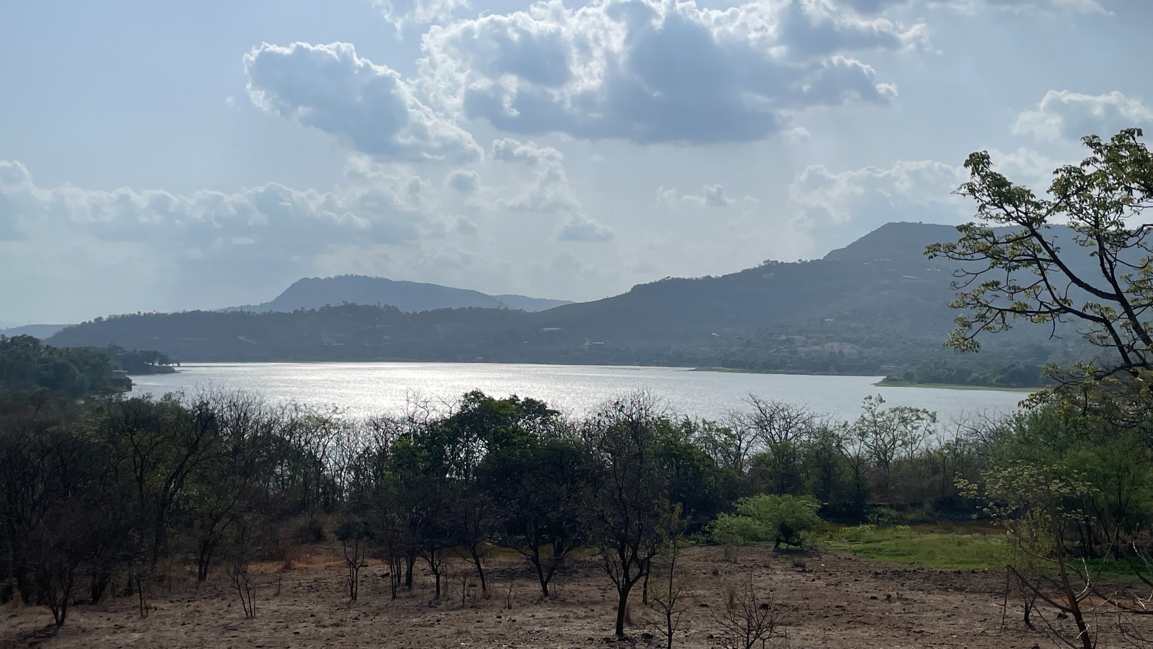 Lush green Sahyadri mountain valley with misty horizon at Raynovaa estate